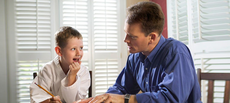 parent helping a child with schoolwork