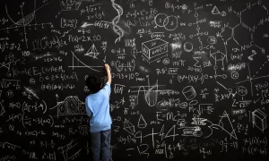 Boy with Math On Chalkboard